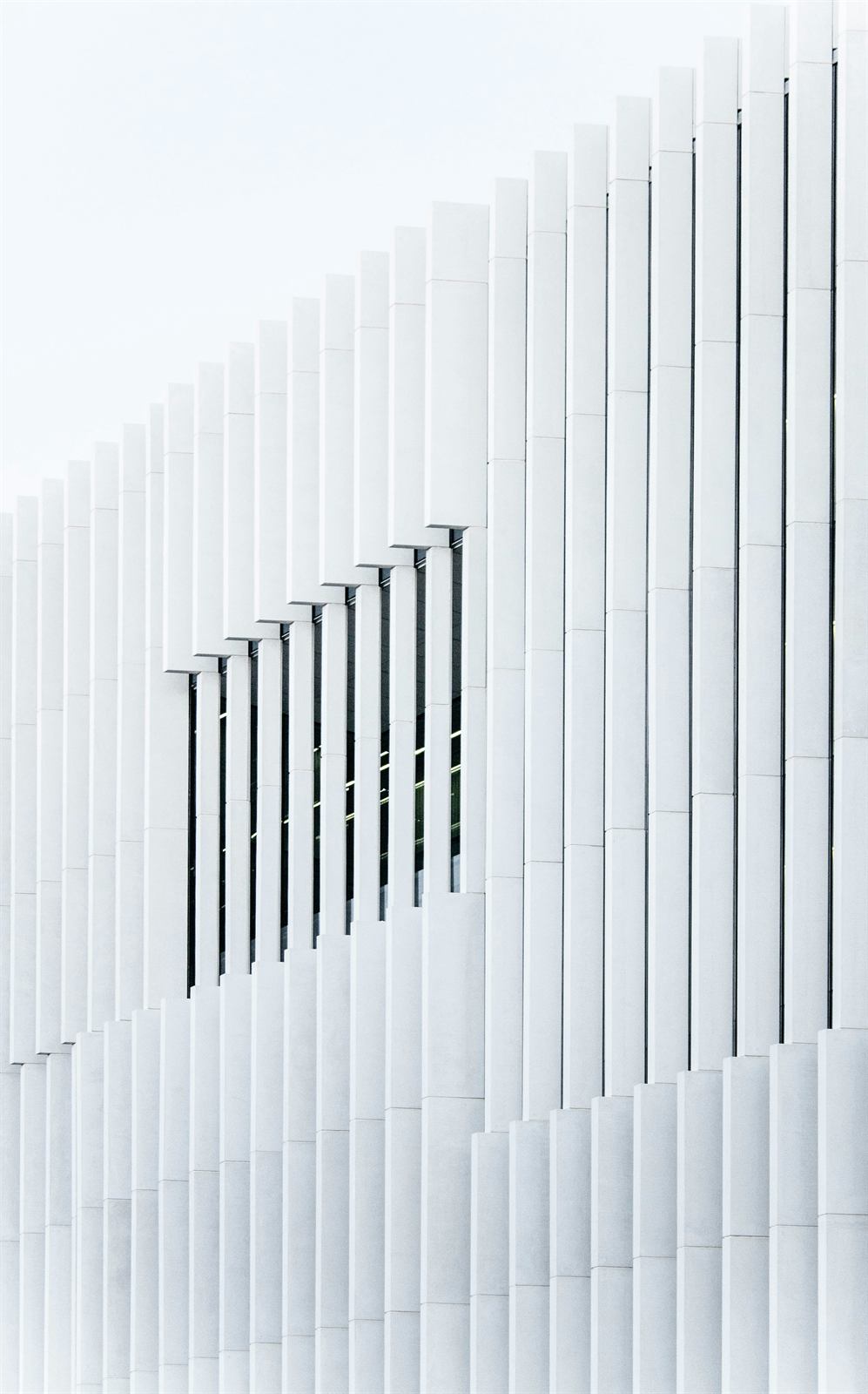 White vertical fins on a modern building facade