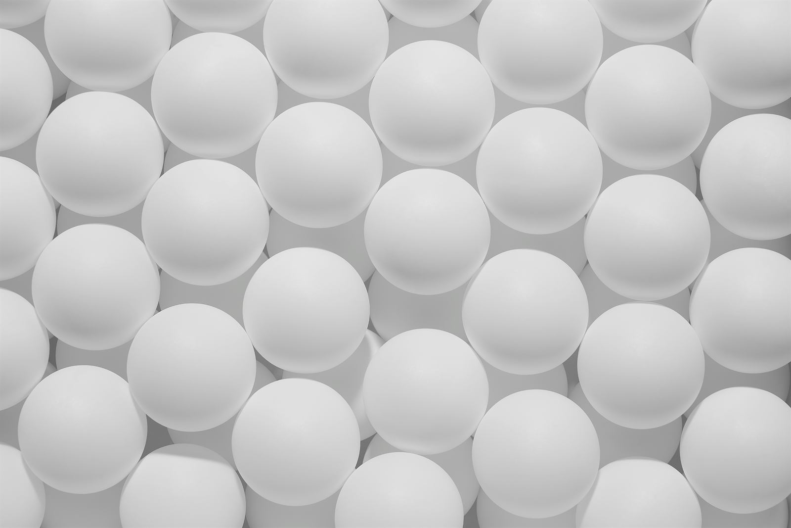 Rows of matte white spheres